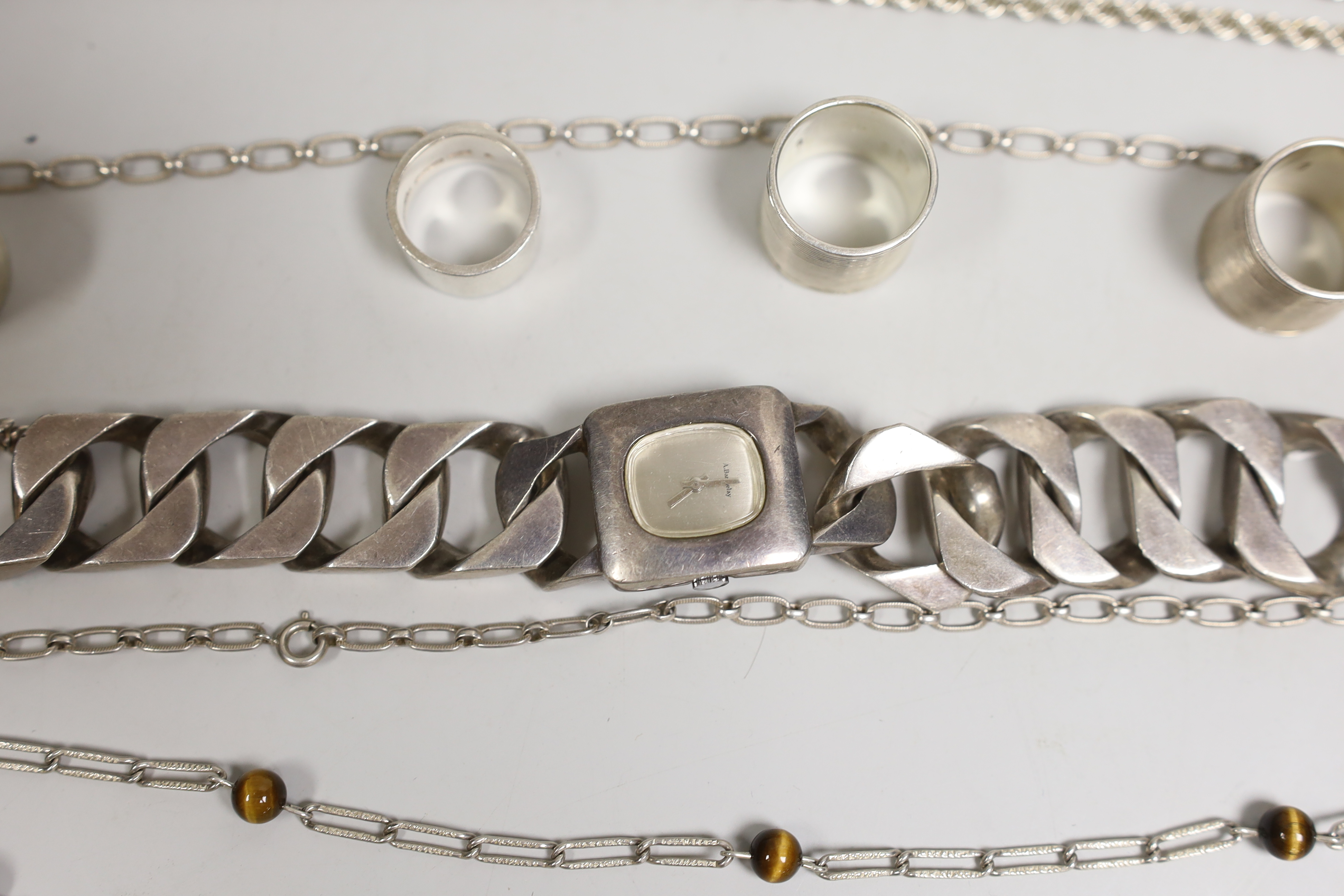 Sundry silver and white metal jewellery etc. including T-bars, necklaces, rings and a large curb link bracelet watch.